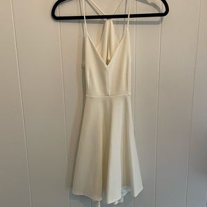 White, open back, mini dress.